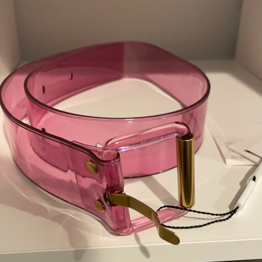 Translucent pvc belt, gold hardware. Approx. 2 width.